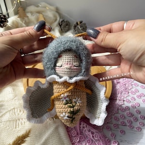 Variation of the crochet butterfly doll in vibrant colors, illustrating the customizable options of this digital pattern. Create a personal, unique toy for gifting or decor with an eco-friendly twist.