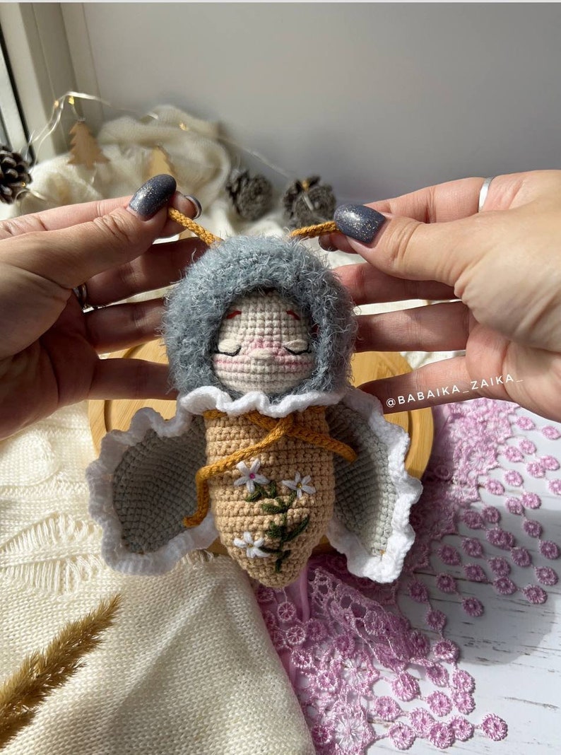 Variation of the crochet butterfly doll in vibrant colors, illustrating the customizable options of this digital pattern. Create a personal, unique toy for gifting or decor with an eco-friendly twist.