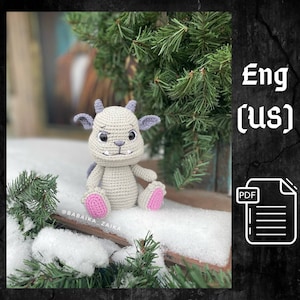 Può includere: Schema di amigurumi all'uncinetto per un mostro grigio e rosa con occhi grandi. Lo schema è disponibile in inglese (USA) ed è in formato PDF.