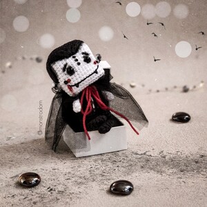 Charming vampire pair crocheted using our PDF pattern – the perfect addition to Halloween decor. Create eco-friendly, handmade toys with a unique design that shows your love and creativity
PDF Crochet Pattern Baby Dracula Amigurumi | DIY Halloween Vampire Doll | Handmade Cute Gift Idea | Digital Tutorial for Crochet Toy