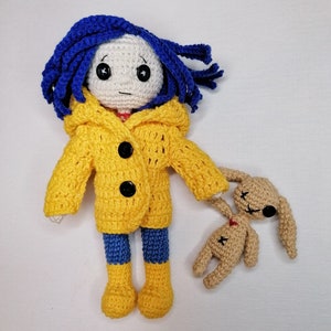 A close-up shot focusing on Coraline’s button eyes and delicate hand-sewn facial features, emphasizing the unique handmade artistry.