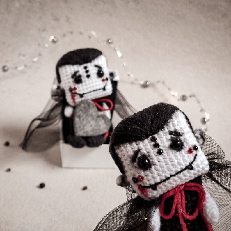 Miniature handmade Dracula vampire toy – an ideal crochet project for gifting or decorating. Digital pattern for creating unique, love-infused toys with a personal touch.