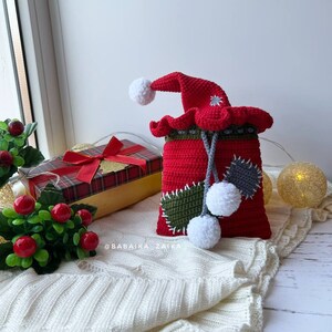 Handmade amigurumi Gizmo in a red and white Santa hat, perfect for Christmas decorations or gifting, eco crochet pattern.