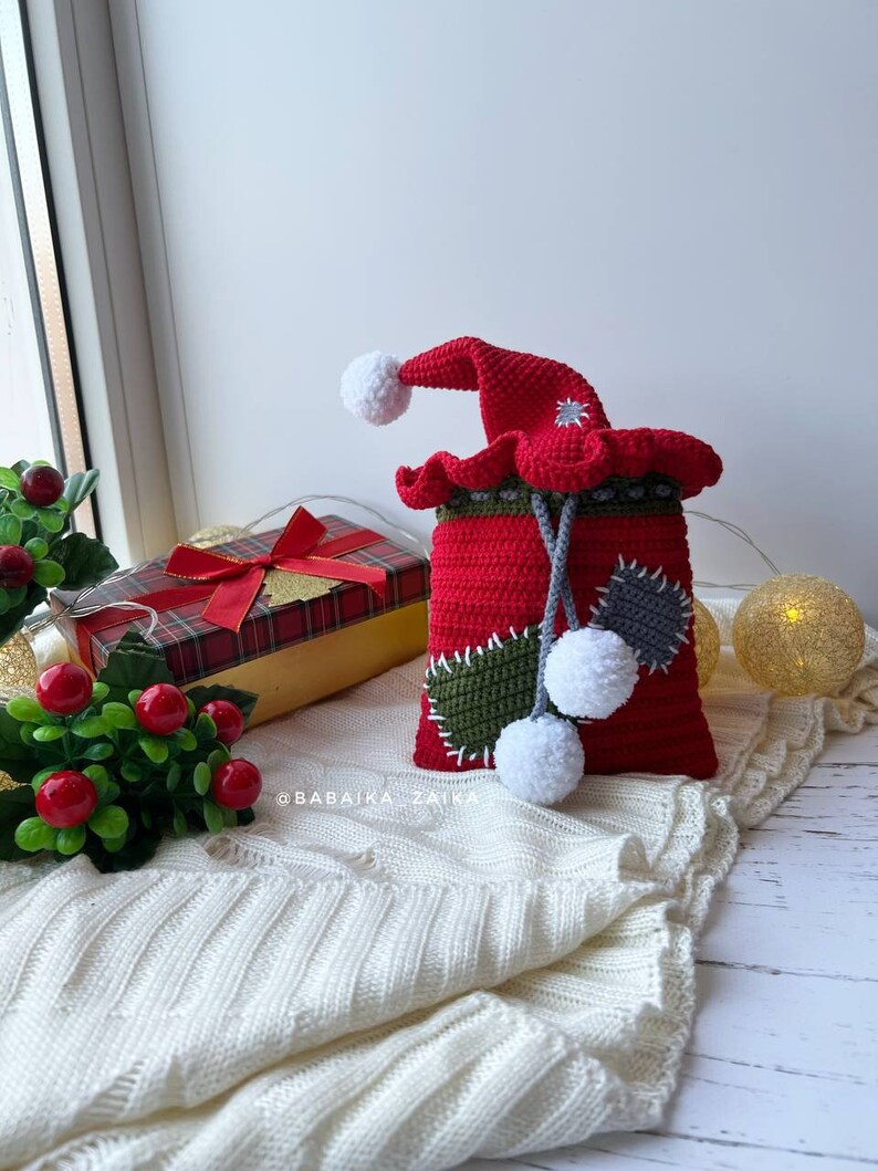 Handmade amigurumi Gizmo in a red and white Santa hat, perfect for Christmas decorations or gifting, eco crochet pattern.