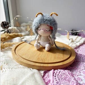 Close-up view highlighting the delicate antennae of the handmade butterfly doll. Crafted with love, this eco-friendly crochet pattern offers a unique, sustainable gift idea for special occasions.