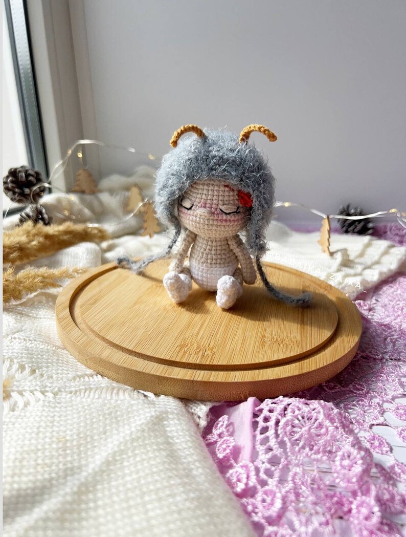 Close-up view highlighting the delicate antennae of the handmade butterfly doll. Crafted with love, this eco-friendly crochet pattern offers a unique, sustainable gift idea for special occasions.