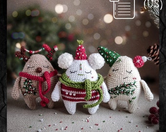 May include: Three crocheted Christmas ornaments, each with a different design. The first is a reindeer with brown fur, red antlers, and a red scarf. The second is a white bear with a green and red sweater and a white scarf. The third is a white snowman with a green hat and a green scarf. All three ornaments have a festive Christmas theme.