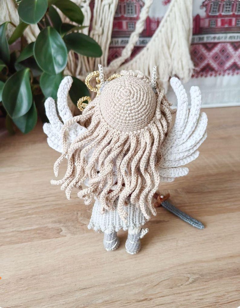 Finished warrior doll posed in forest-style decor with dried foliage