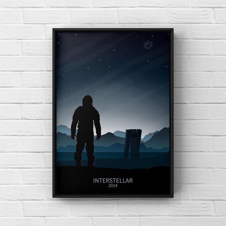 May include: A black and white minimalist poster featuring a silhouette of an astronaut standing in a desolate landscape with the text "Interstellar 2014".