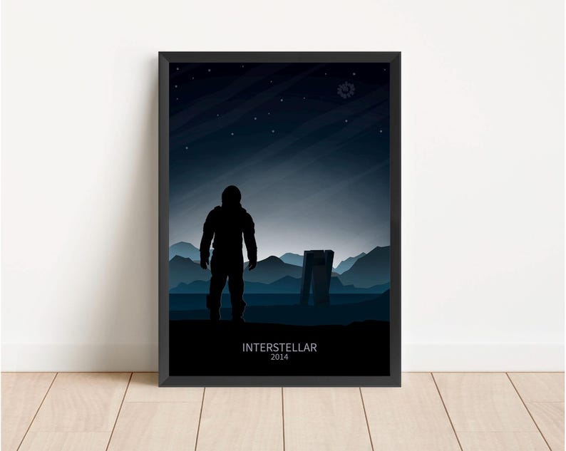 May include: A black and white poster with a silhouette of an astronaut standing on a desolate planet. The text "Interstellar 2014" is at the bottom of the poster.