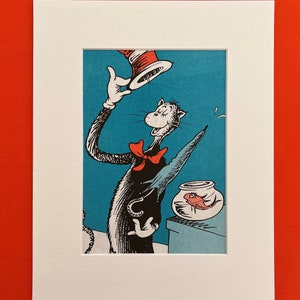May include: A framed print of the Cat in the Hat illustration. The character, in a black suit and red bow tie, is holding his red and white striped hat. A fishbowl with a red fish is also visible in the image.