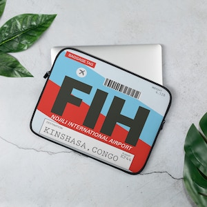May include: A blue, red, and white laptop sleeve with a luggage tag design. The tag says "FIH NDJILI INTERNATIONAL AIRPORT" and "KINSHASA, CONGO". The flight number is KP44 and the weight is 4.51B.