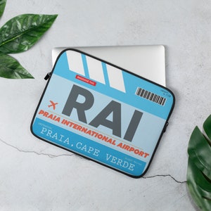 May include: Blue and white laptop sleeve with a luggage tag design. The tag says "RAI PRAIA INTERNATIONAL AIRPORT" and "PRAIA, CAPE VERDE".