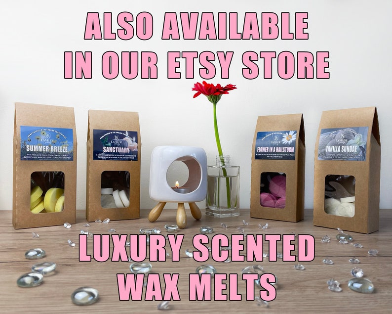 May include: Four brown paper bags with clear windows displaying wax melts in various scents, including Summer Breeze, Sanctuary, Flower in a Hailstorm, and Vanilla Sundae. The bags are on a wooden surface with clear glass stones scattered around. A white ceramic wax warmer with a candle inside is in the centre of the image. The text "ALSO AVAILABLE IN OUR ETSY STORE" is at the top of the image, and the text "LUXURY SCENTED WAX MELTS" is at the bottom of the image.