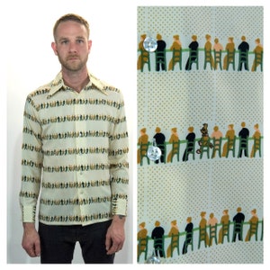 May include: A long-sleeved shirt with a white background and a repeating pattern of people sitting on chairs. The people are wearing brown, green, and black clothing. The shirt has a button-down collar and a button-up front.