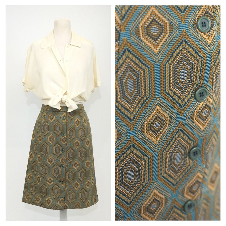 May include: A green and brown geometric patterned skirt with a button front closure. The skirt is knee-length and has a fitted silhouette.