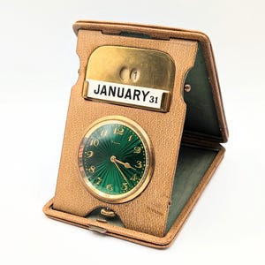 Spectaculaire horloge vintage calendrier de voyage suisse