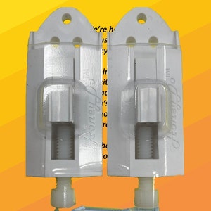 May include: Two white adjustable picture hangers with a capacity of 35 pounds each. The hangers are shown with nails and a QR code. The text "Honey Do™" is on the top of the image. The text "ADJUSTABLE PRECISION PLACEMENT PICTURE HANGER" is in red letters. The text "2 PACK" is in black letters. The text "Capacity each Hanger 35 lbs 16 kg" is in black letters. The text "Nail the hanger once - Adjust the picture height - No need to make multiple holes for alignment" is in black letters. The text "Hang with: Provided nail(s), Sheetrock Molly, Velcro™, Command™ strip - (See Capacity Chart) copyright 2022 Lone Star Consulting, all rights reserved" is in black letters.