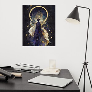 May include: A poster featuring a watercolor painting of a figure in a dark cloak with flowing white and gold accents, set against a dark, starry background. A golden halo surrounds the figure, with a celestial design. The artwork has a mystical theme.