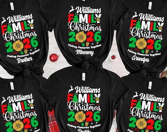 May include: Six black short-sleeve t-shirts featuring a graphic with the text Williams FAMILY Christmas 2026 Making Memories Together. Each shirt includes a green Christmas tree, a gold ornament, and a specific family role label like Mommy or Daddy.
