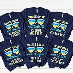 May include: Six navy blue t-shirts with white text and a graphic of sunglasses with palm trees and an anchor. The text on the shirts reads "Cruise Crew" and "most likely to" followed by a different phrase on each shirt.