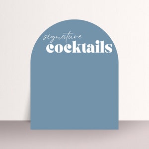 May include: A blue arch-shaped sign with the text "signature cocktails" in white lettering.