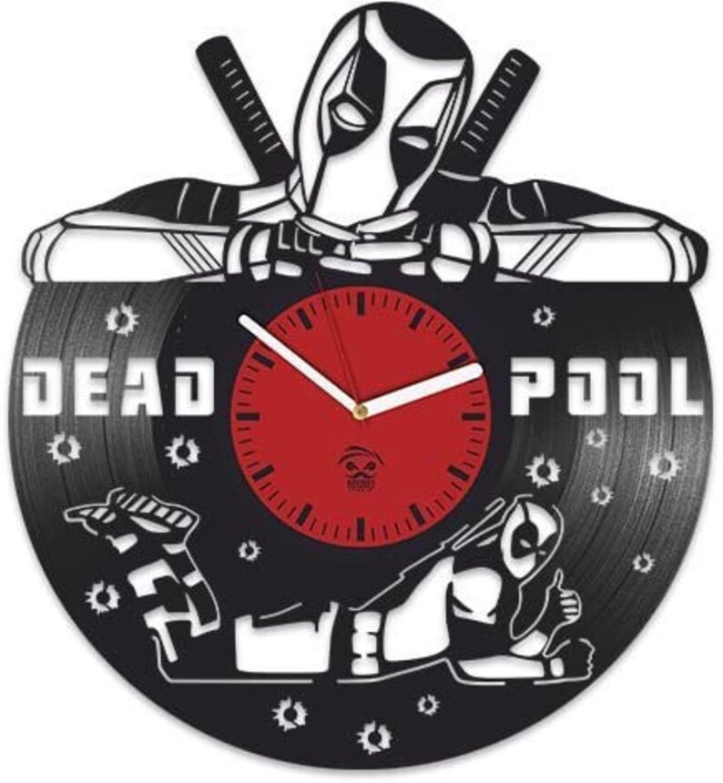 May include: Black vinyl record clock featuring a silhouette of Deadpool in a fighting pose. The clock face is red with white clock hands and black numbers. The record has the words "DEADPOOL" printed on it.