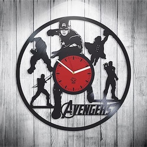 May include: Black vinyl record clock featuring a silhouette of Captain America and other Avengers characters. The clock face is red with white hands and the words "Avengers" are printed below the clock face.