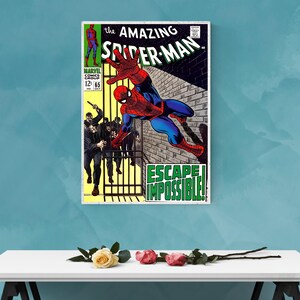 Op de afbeelding: Een ingelijste stripboekcover van The Amazing Spider-Man, nummer 65. De illustratie toont Spider-Man in een dynamische pose, met de tekst "ESCAPE IMPOSSIBLE!" en een bakstenen muur als achtergrond. Het Marvel Comics-logo is zichtbaar.