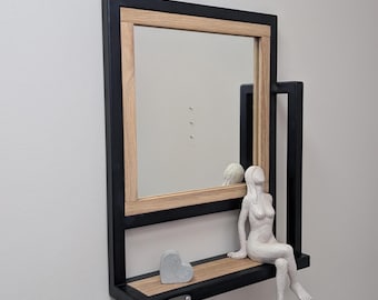 Industrial mirror with wooden shelf, modern cube-shaped metal frame, and square frame. Portrait size for a hallway or entryway.