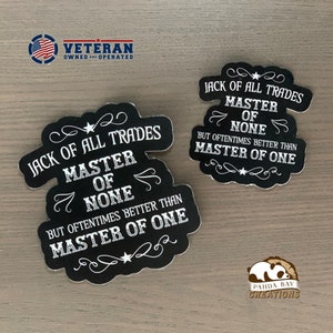 May include: Two black and white chalkboard-style stickers with the text "Jack of all trades, master of none, but oftentimes better than master of one." The stickers have a decorative border with stars and swirls.