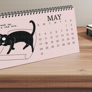 2025–2026 office cat desk calendar with funny black cat illustrations and sarcastic office quotes. Academic calendar with custom start date option. Perfect for office decor, desk accessories, cubicle gifts, or work from home setups. A great gift for cat lovers, students, teachers, coworkers, and anyone surviving corporate life. Minimalist and humorous calendar for professionals and cat moms.