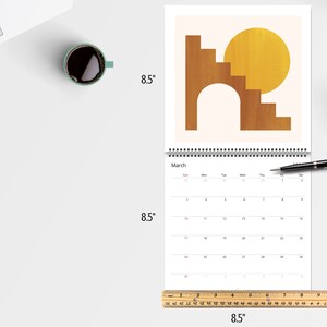 Mid Century Abstract 2026 Wall Calendar featuring minimalist retro geometric shapes in earthy tones. A stylish boho wall calendar for modern homes, perfect for fans of mid century modern decor, abstract art lovers, and anyone who loves clean, neutral wall art. Customizable square calendar ideal for feminine office decor, dorms, or boho-inspired interiors.