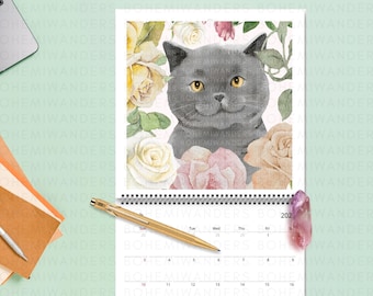 May include: A gray cat with green eyes sits in a bed of pink and white flowers. The cat is surrounded by leaves and flowers. The image is a watercolor painting.