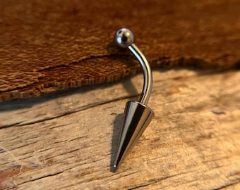 May include: A silver belly button ring with a small ball on one end and a pointed cone on the other end.