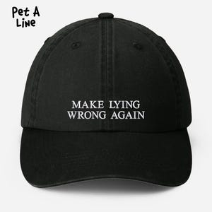 May include: Black baseball cap with white embroidered text that reads "Make Lying Wrong Again".