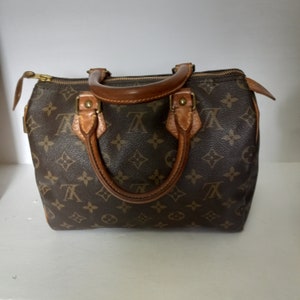 Sold at Auction: A Louis Vuitton Speedy Canvas Monogram Bag with Dust  Cover. Checked LV canvas with padlock. Red textile interior. 33cm x 25cm.  Ref: 13260. In good condition but please see