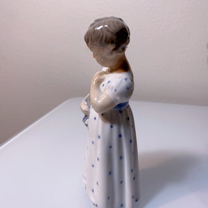 Porcelain Figurine of a Girl with a Doll, Royal Copenhagen, Denmark at
