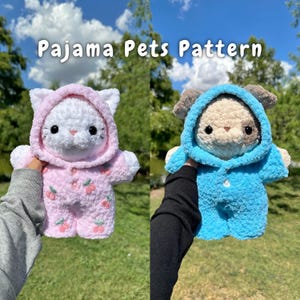 May include: Two crocheted stuffed animals wearing pyjamas. A white cat wearing a pink hooded pyjama with cherry print and a brown dog wearing a blue hooded pyjama.