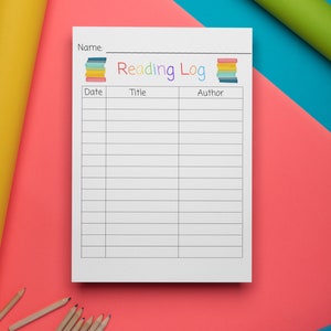 May include: A white reading log with the words "Reading Log" in colorful letters. The log has columns for date, title, and author. There are pencils and colorful rolled up paper on a pink and blue background.