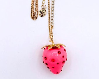 Betsey Johnson long gold tone bow accent to pink acrylic strawberry necklace