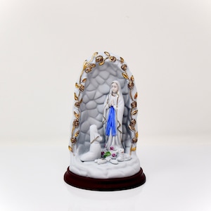 Statue of Saint Bernadette and Our Lady of Lourdes.