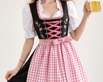 May include: A traditional black and pink dirndl dress with floral embroidery and a pink gingham apron. The dress features a white blouse with puffed sleeves and a pink ribbon corset. A glass of beer is held in the hand.