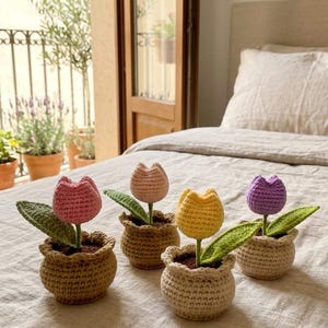 May include: A white ceramic mug with a black handle and the text "But First, Coffee" in a black, bold font. The mug is sitting on a white surface.