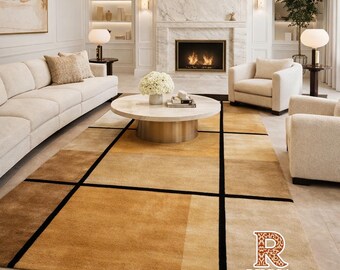 May include: A rectangular area rug with a geometric design in shades of brown and tan, accented by black lines. The rug is placed in a living room setting with a sofa, chairs, and a coffee table. The text "RUGSA" is visible on the rug.