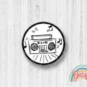 May include: A black and white sketch of a boombox with musical notes on a white circular background. The design is surrounded by a black border. The image is on a light wood grain background.
