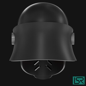 Puede incluir: Un dise&ntilde;o de casco negro y futurista con una parte superior redondeada y una secci&oacute;n inferior acampanada. El casco presenta peque&ntilde;os detalles cil&iacute;ndricos en los laterales y una zona inferior facial ventilada. La est&eacute;tica general es elegante y moderna.