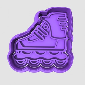 May include: Purple plastic roller skate cookie cutter. The cutter is shaped like a roller skate with a boot, wheels, and laces.