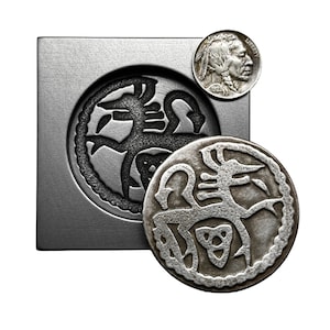 May include: A silver metal mold with a circular design of a stylized animal. A silver metal coin with the same design is next to the mold. A silver coin with the image of a Native American is in the upper right corner.