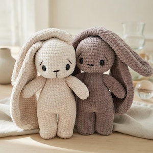 May include: A white ceramic mug with a black handle and the text "But First, Coffee" in a black, handwritten-style font. The mug is on a white surface.